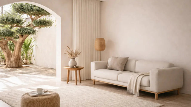 Light filled living room with neutral sofa and textured rug, avoiding regret purchases for your home.