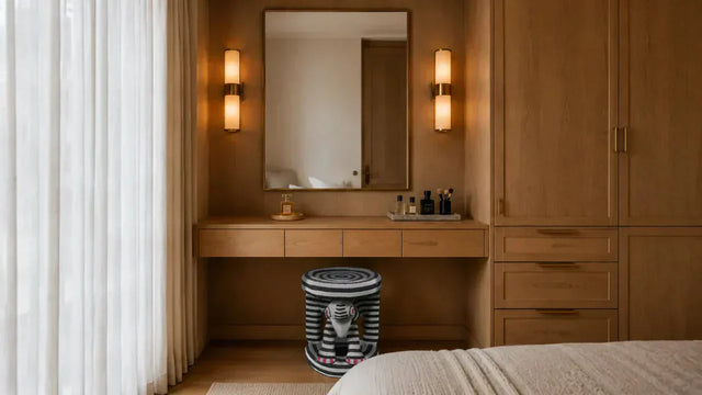 Bamileke stool beneath a dressing table surrounded by daily-use personal objects, showing how objects become meaningful through repeated routine