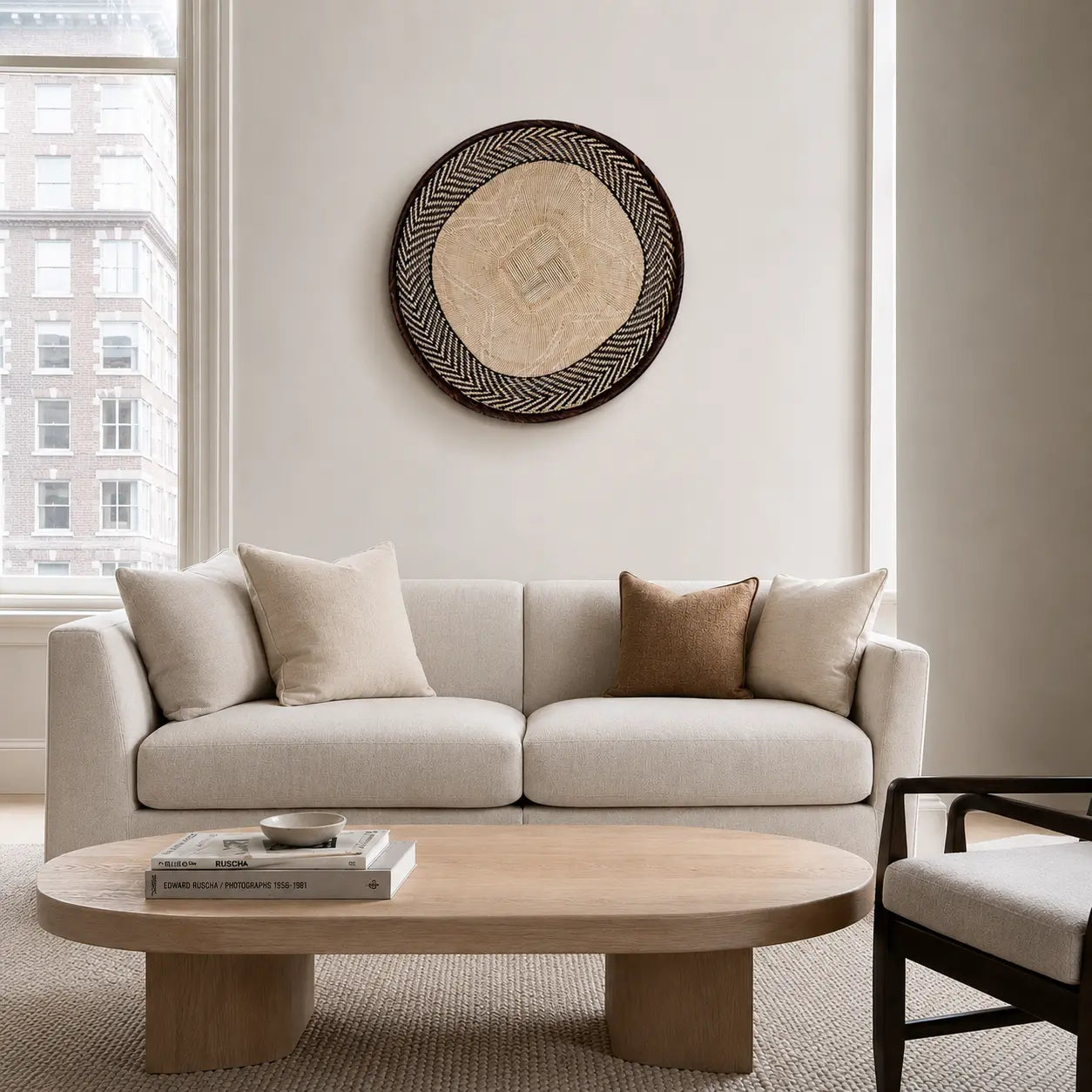 Basket wall art handwoven in Zimbabwe, brown Binga weave with flat back in a living room
