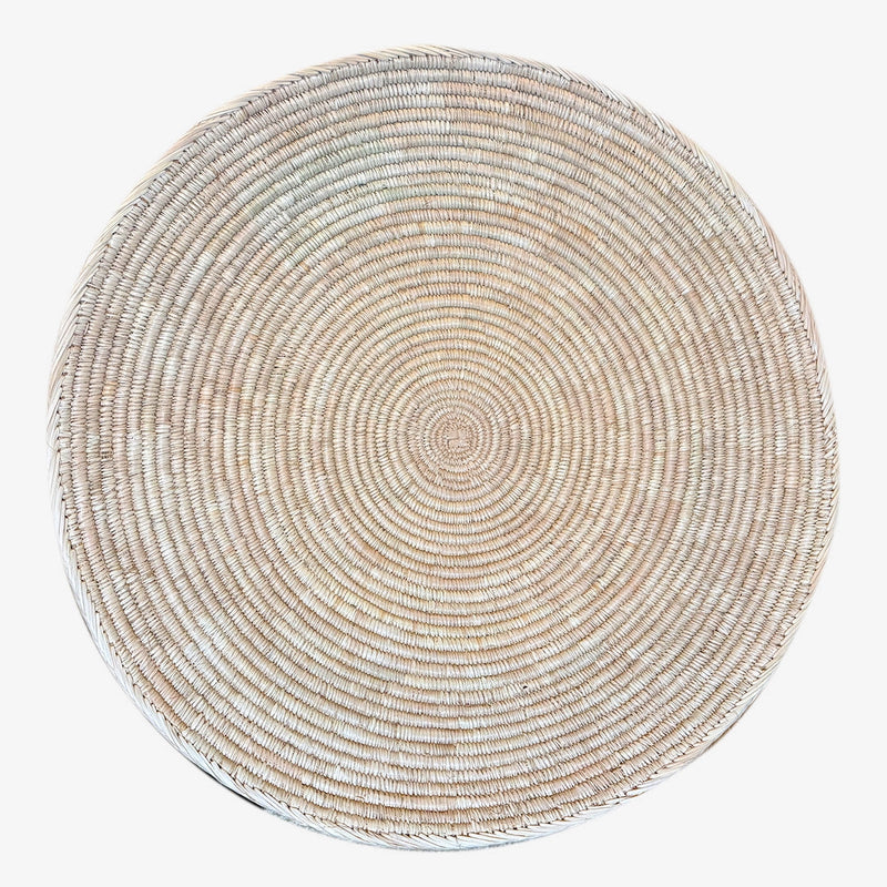 Flat woven wall basket in the Ndebele tradition, handwoven in Zimbabwe, natural cream pattern
