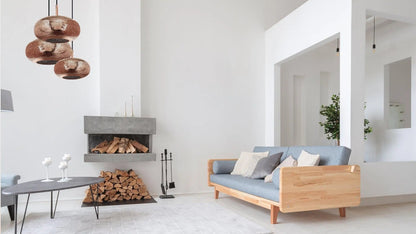 Lila Living Room Chandelier illuminates a modern minimalist living room.