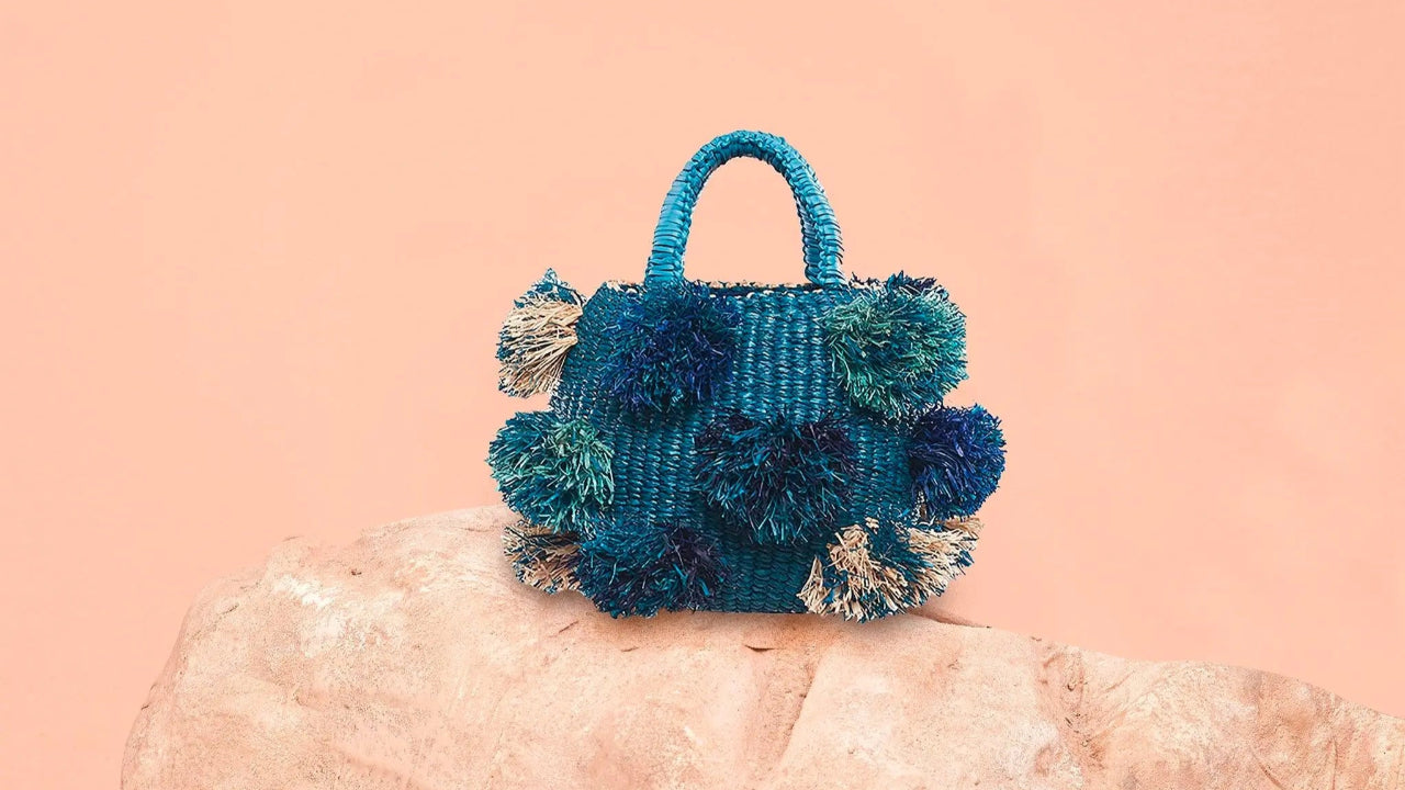 This handmade Pom Pom Bag Blue from 54kibo is the perfect gift for girls who want bold, stylish, and functional accessories.