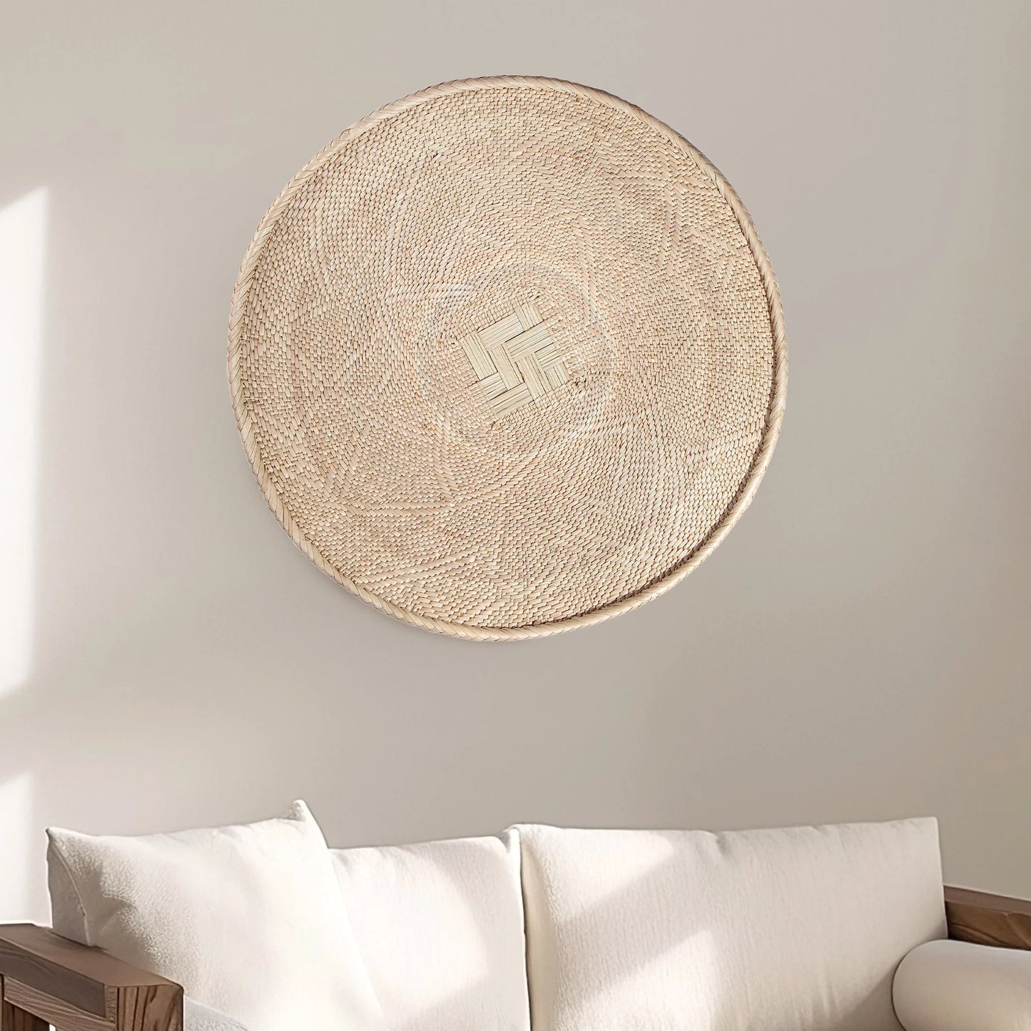 Round Binga wall basket decor handwoven in Zimbabwe, neutral natural fiber with geometric weave large