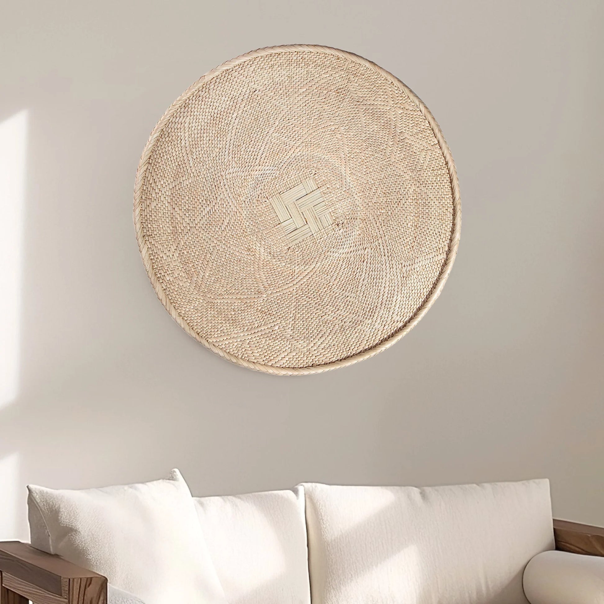 Round Binga wall basket decor handwoven in Zimbabwe, neutral natural fiber with geometric weave large