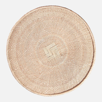 Round Binga wall basket handwoven in Zimbabwe, neutral natural fiber with geometric weave