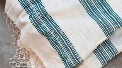 The handwoven Tana Teal Bath Towel from 54kibo is a practical gift for boys and tweens who are learning to be independent.